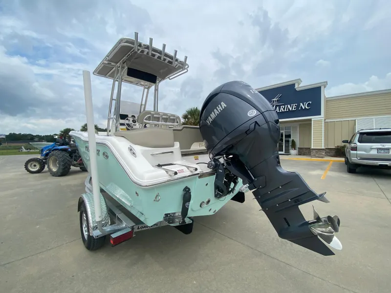 Slide: The Image of 2024 Key West 203 FS boat with Yamaha outboard motor at dealership. - 3