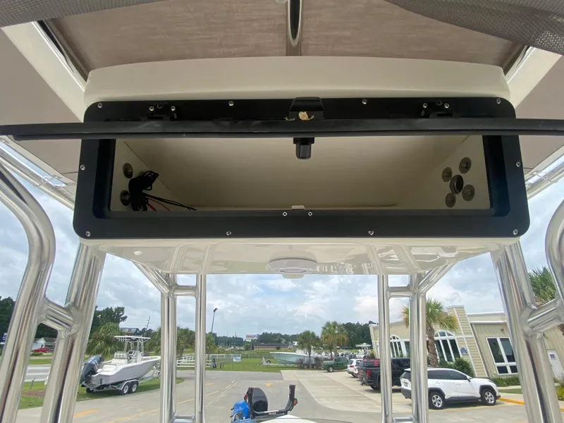 Slide: The Image of 2024 Key West 203 FS boat with open storage compartment. - 12