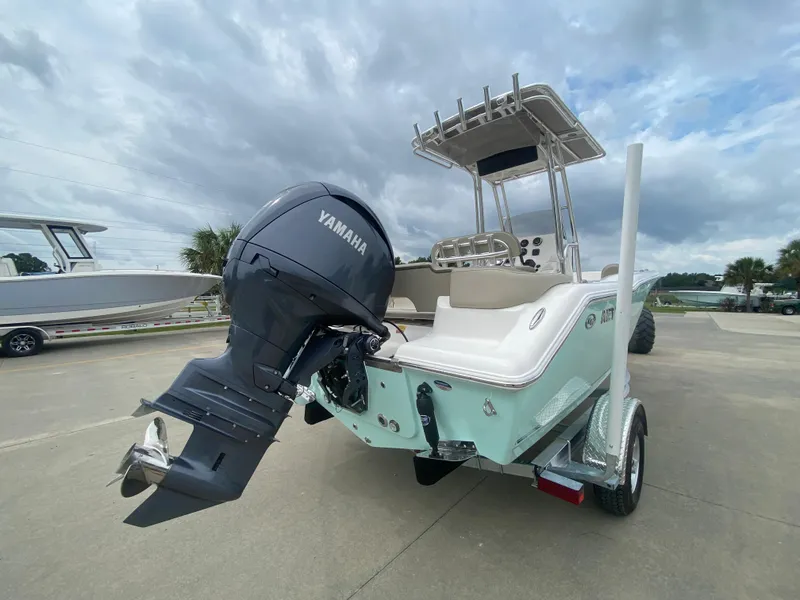 Slide: The Image of 2024 Key West 203 FS boat with Yamaha outboard motor on trailer. - 2