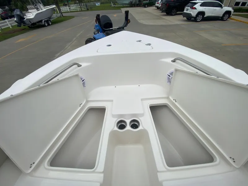 Slide: The Image of 2024 Key West 203 FS boat with open storage compartments. - 20