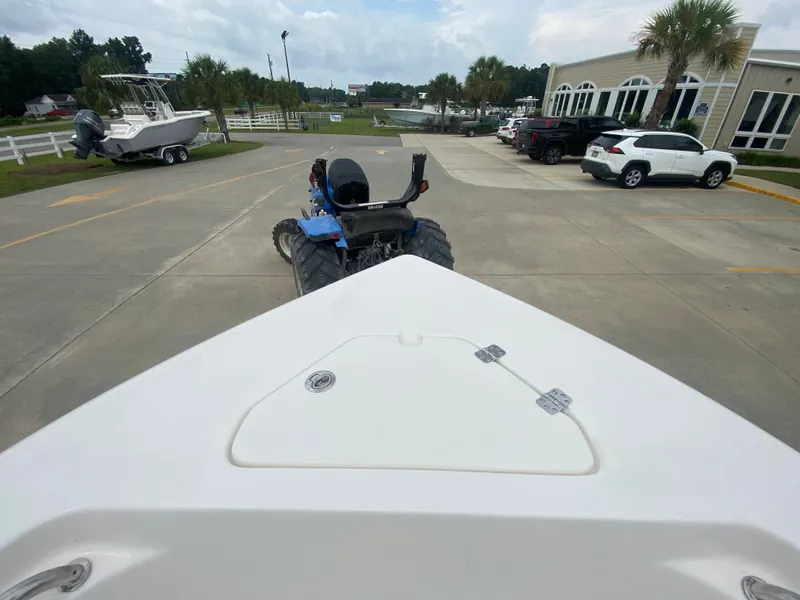 Slide: The Image of 2024 Key West 203 FS boat on trailer in dealership parking lot. - 21