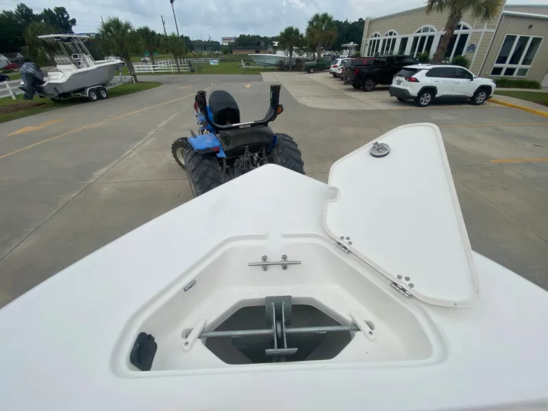 Slide: The Image of 2024 Key West 203 FS boat anchor compartment with open lid. - 22