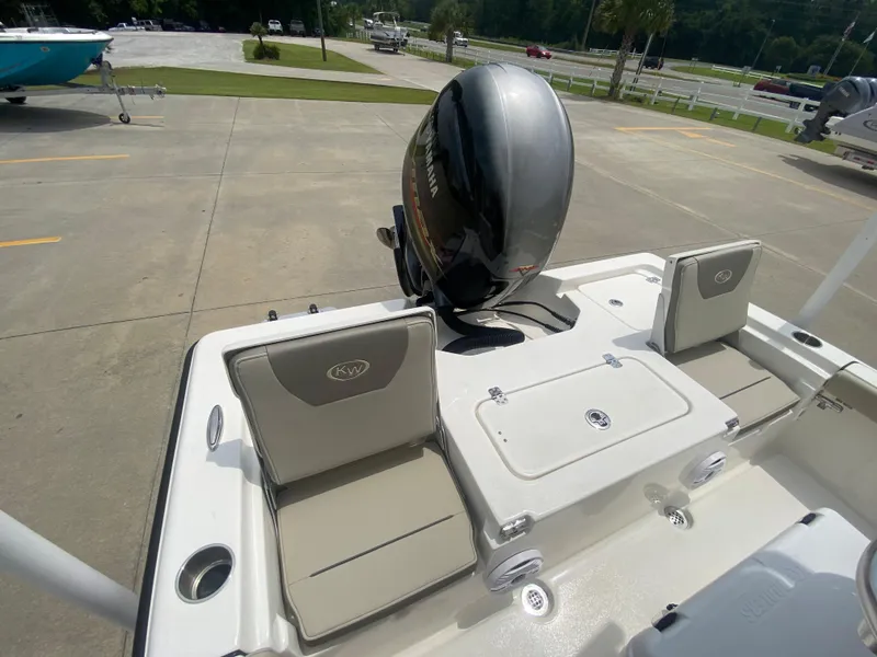 Slide: The Image of 2024 Key West 210 Bay Reef boat with outboard motor and seating. - 8