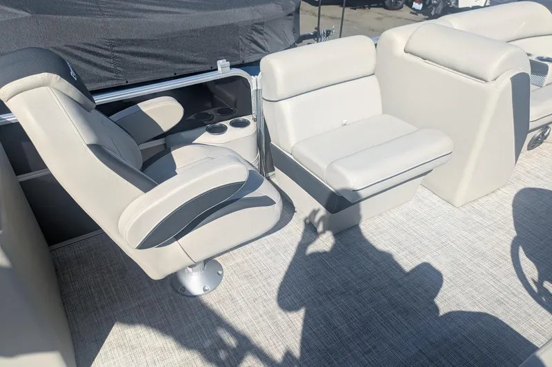 Slide: The Image of 2023 Berkshire 24 RFX LE boat interior with plush seating and cup holders. - 10