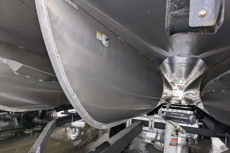 Slide: The Image of Underneath view of a 2023 Berkshire 24 RFX LE pontoon boat on a trailer. - 17