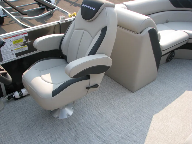 Slide: The Image of 2023 Berkshire 24 RFX LE boat interior with captain's chair and seating. - 4