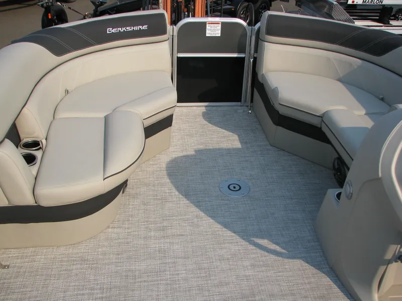 Slide: The Image of 2023 Berkshire 24 RFX LE pontoon boat interior with plush seating and modern design. - 6