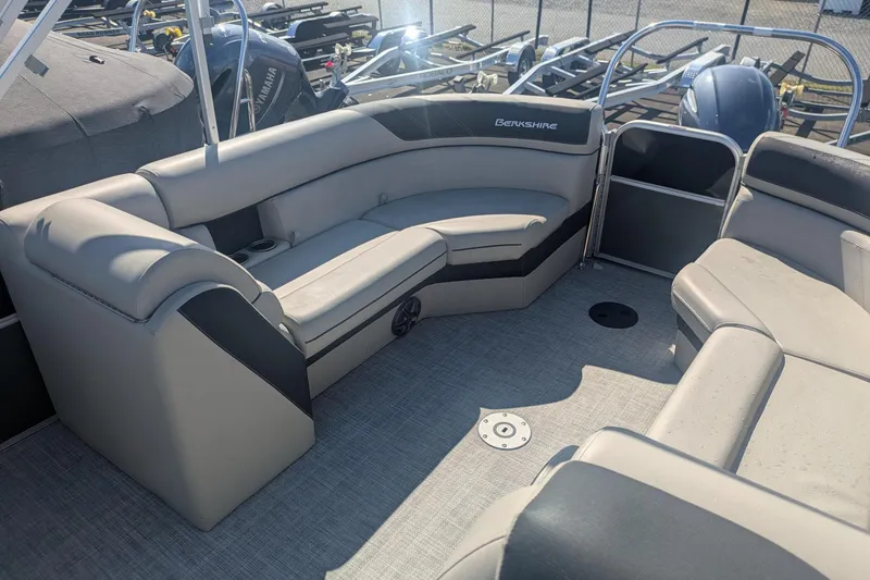 Slide: The Image of 2023 Berkshire 24 RFX LE pontoon boat interior with plush seating and modern design. - 9