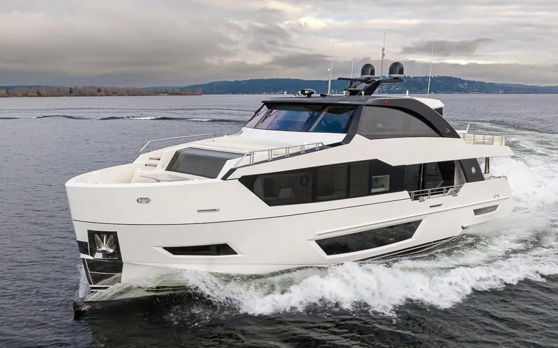Slide: The Image of 2024 Ocean Alexander Revolution yacht cruising on open water. - 14