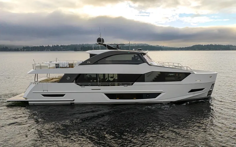 Slide: The Image of 2024 Ocean Alexander Revolution yacht on calm water with scenic background. - 18