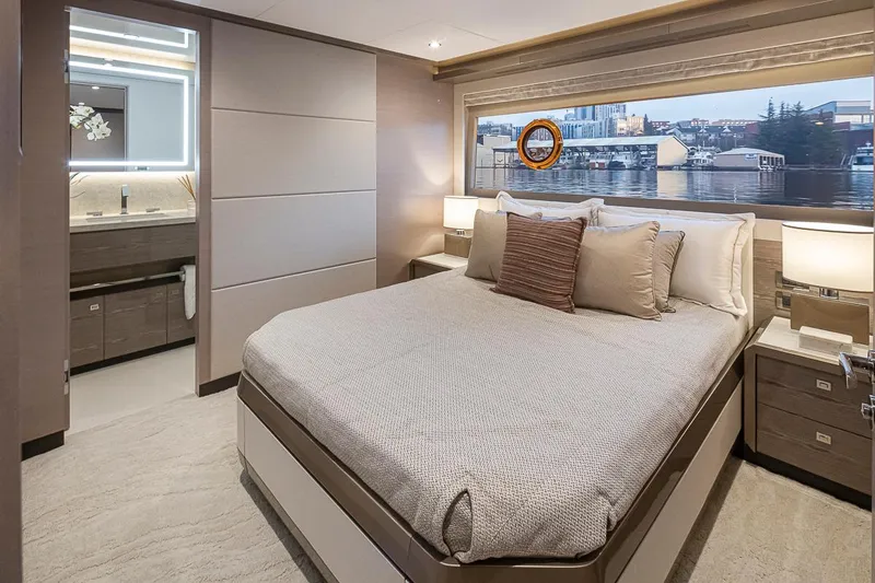 Slide: The Image of Luxurious bedroom on the 2024 Ocean Alexander Revolution yacht with city view. - 41