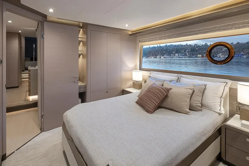 Slide: The Image of Luxurious bedroom in 2024 Ocean Alexander Revolution yacht with waterfront view. - 42