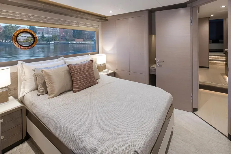 Slide: The Image of Luxurious bedroom interior of 2024 Ocean Alexander Revolution yacht with waterfront view. - 43