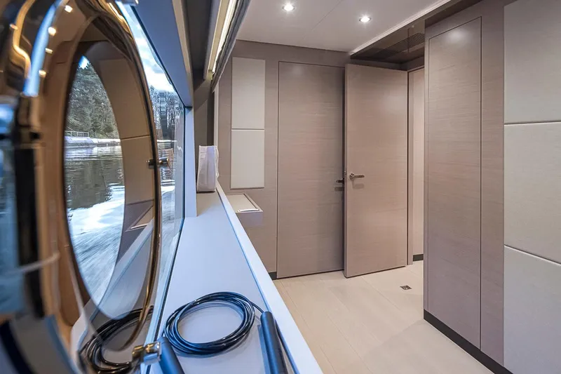 Slide: The Image of Interior of 2024 Ocean Alexander Revolution yacht with modern design and porthole view. - 45