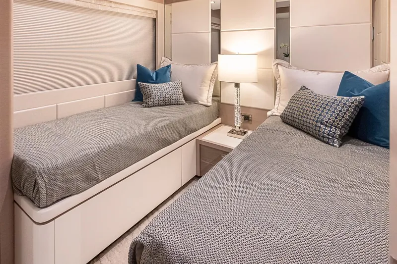 Slide: The Image of 2024 Ocean Alexander Revolution twin bed cabin with modern decor. - 49