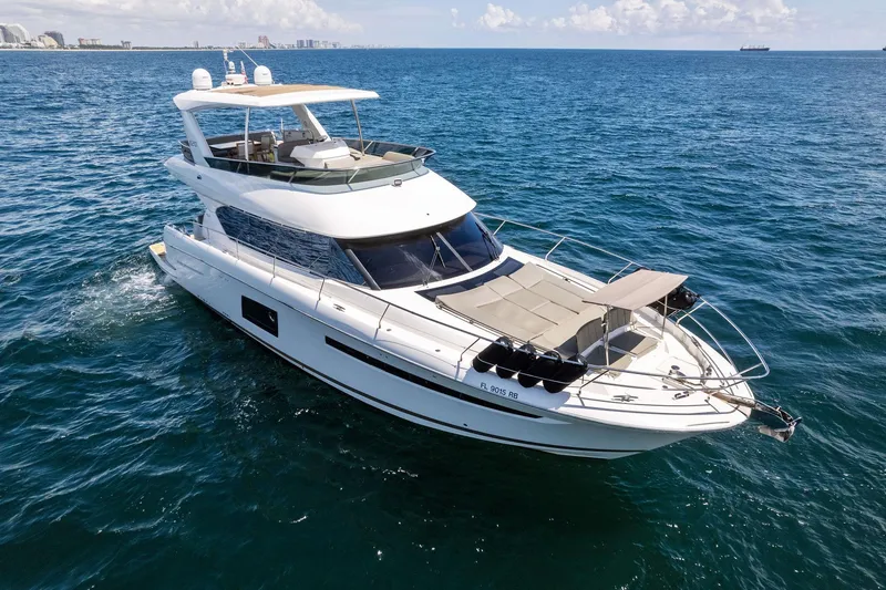 Slide: The Image of 2016 Prestige 620 yacht cruising on open water. - 1