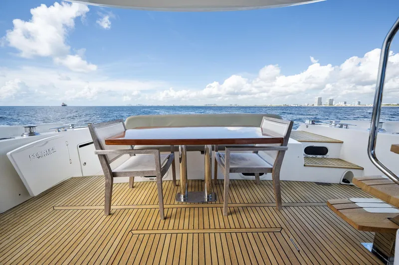 Slide: The Image of Prestige 620 yacht deck with dining area, ocean view, 2016 model. - 12