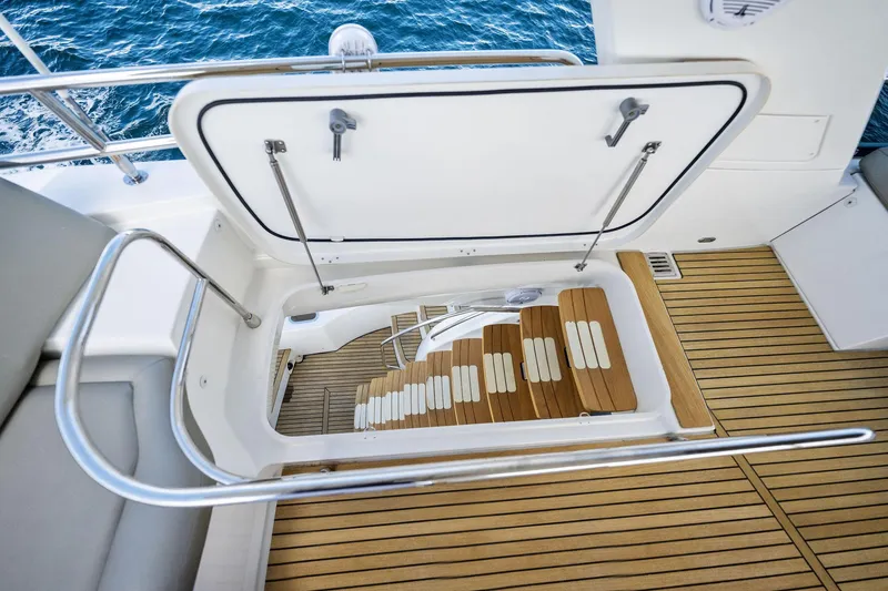 Slide: The Image of Open hatch and stairs on 2016 Prestige 620 yacht with teak flooring. - 15