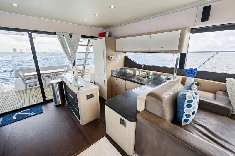 Slide: The Image of Luxurious interior of 2016 Prestige 620 yacht with modern kitchen and ocean view. - 20