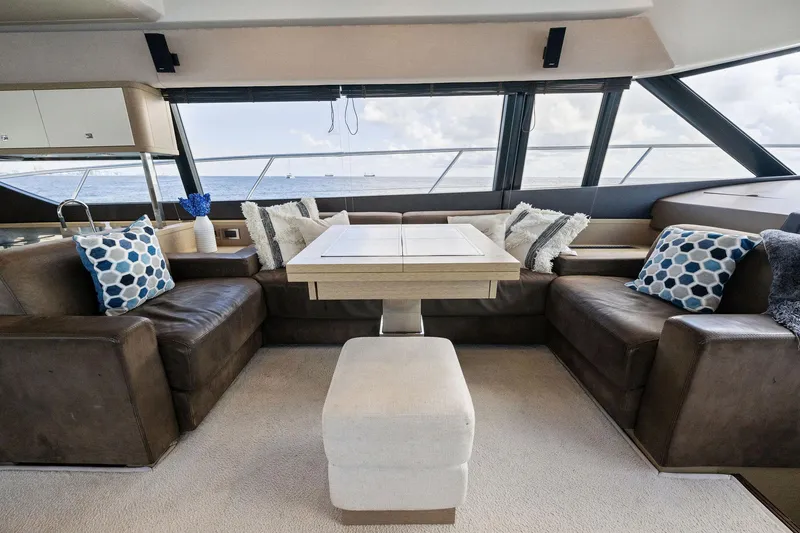 Slide: The Image of Luxurious interior of a 2016 Prestige 620 yacht with leather seating and ocean view. - 22
