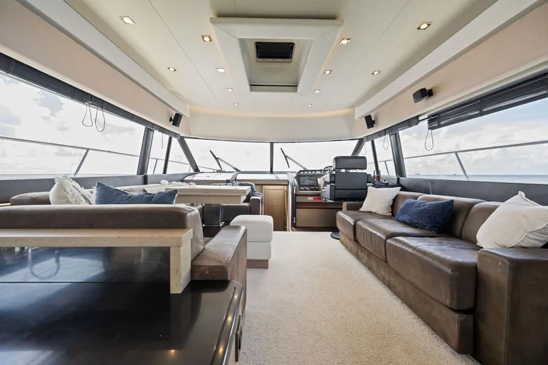 Slide: The Image of Luxurious interior of a 2016 Prestige 620 yacht with modern seating and panoramic windows. - 26