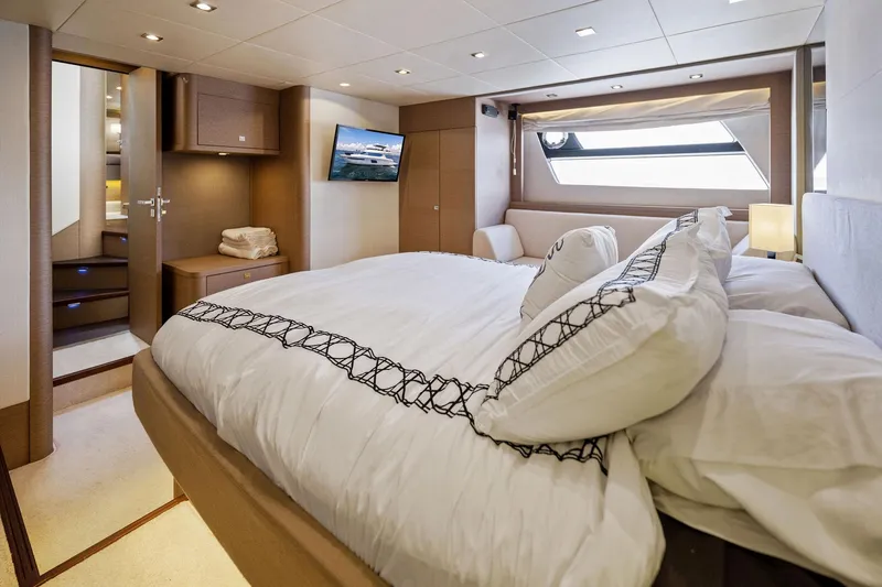 Slide: The Image of Luxurious bedroom interior of 2016 Prestige 620 yacht with modern decor and large bed. - 31