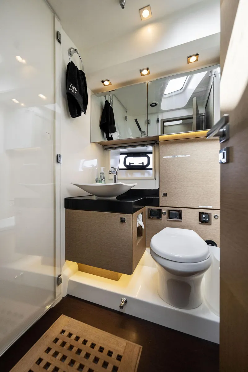 Slide: The Image of Modern bathroom in 2016 Prestige 620 yacht with sleek fixtures and ample lighting. - 35