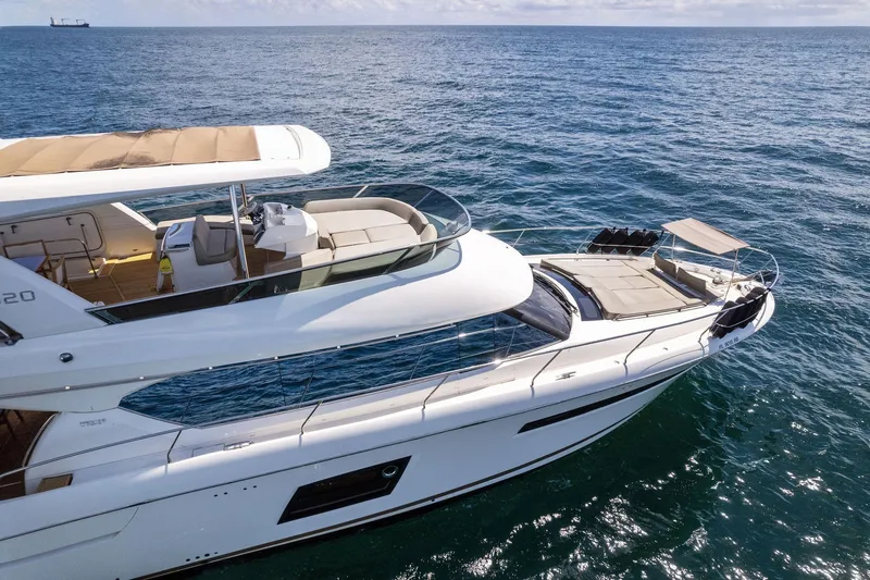 Slide: The Image of 2016 Prestige 620 yacht cruising on open water. - 4
