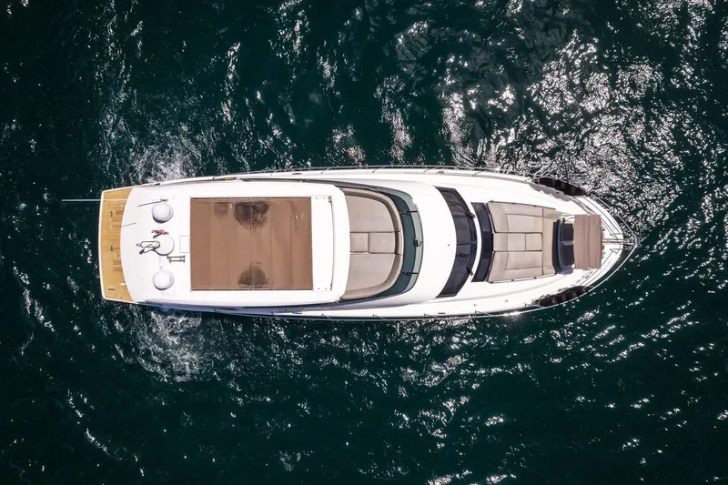 Slide: The Image of Aerial view of 2016 Prestige 620 yacht cruising on open water. - 5