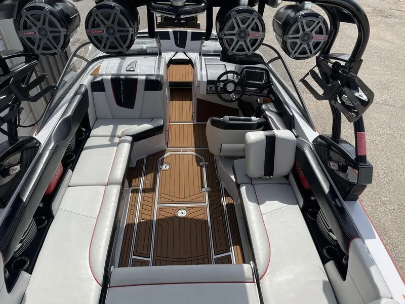 Slide: The Image of 2015 Nautique G23 boat interior with premium seating and advanced audio system. - 3