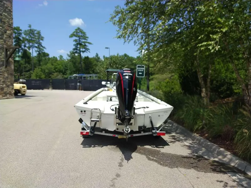 Slide: The Image of 2024 Ranger RB190 boat parked outdoors, rear view. - 1