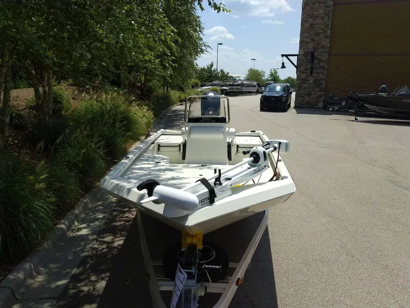 Slide: The Image of 2024 Ranger RB190 boat parked outdoors on a sunny day. - 2