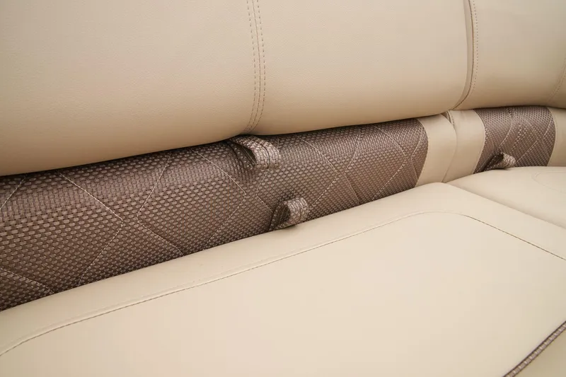 Slide: The Image of 2024 Regency 230 LE3 boat seat with beige and brown upholstery. - 28