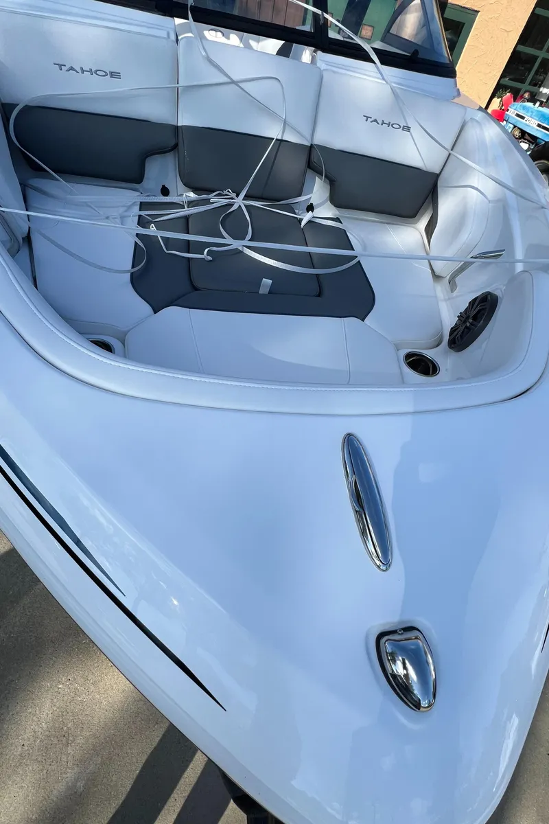 Slide: The Image of 2024 Tahoe 210 S boat interior with seating and storage compartments. - 2