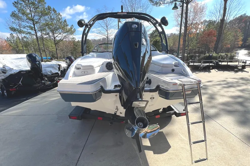 Slide: The Image of 2024 Tahoe 210 S boat rear view with outboard motor and ladder. - 5