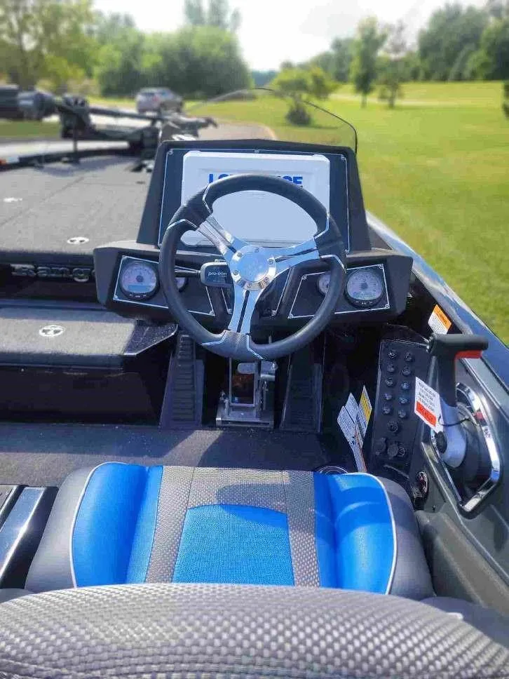 Slide: The Image of 2024 Ranger Z518 Ranger Cup Equipped boat cockpit with steering wheel and control panel. - 6