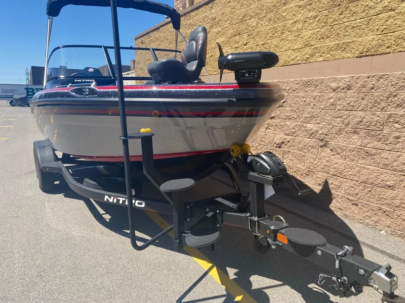 Slide: The Image of 2024 Nitro ZV19 Sport Pro boat on trailer, parked outdoors. - 2