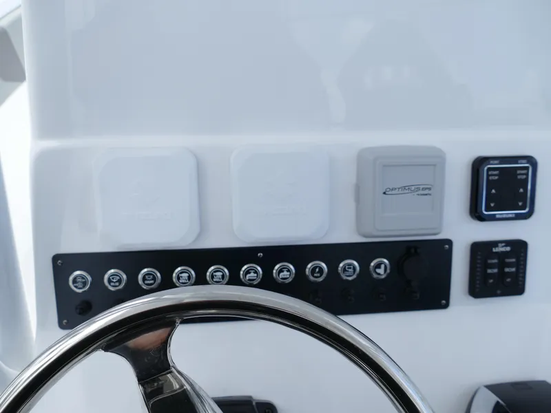 Slide: The Image of 2024 Cape Horn 31T Tournament boat dashboard with steering wheel and control panel. - 14