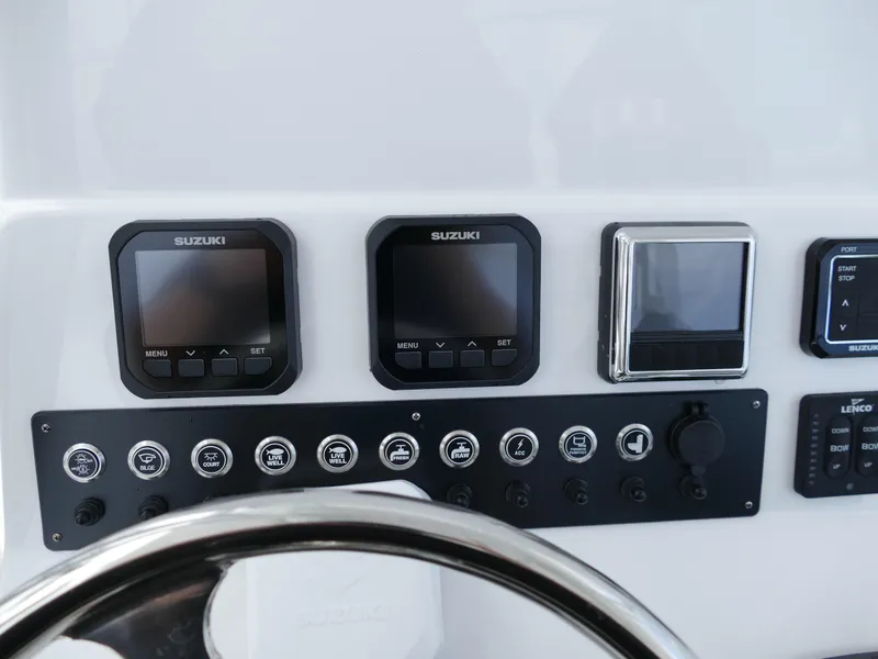 Slide: The Image of 2024 Cape Horn 31T Tournament boat dashboard with Suzuki controls and gauges. - 15