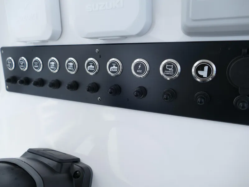 Slide: The Image of Control panel of 2024 Cape Horn 31T Tournament boat with labeled switches. - 16