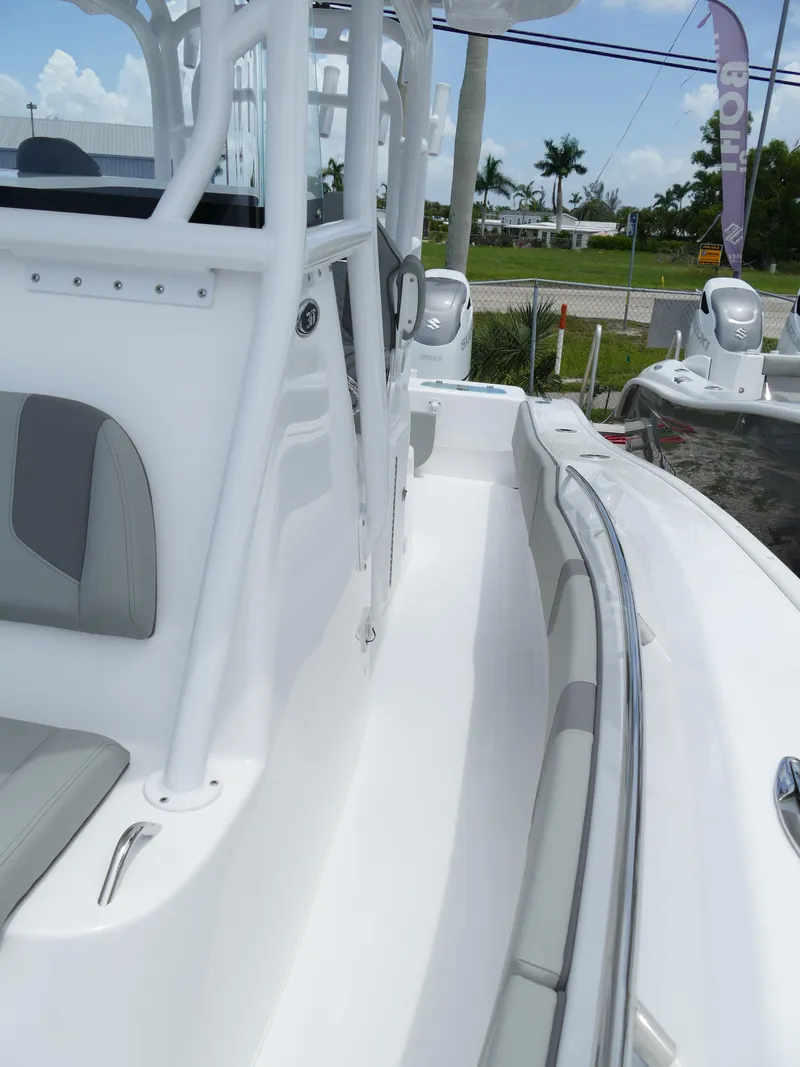 Slide: The Image of 2024 Cape Horn 31T Tournament boat, white interior with gray accents, side view. - 43