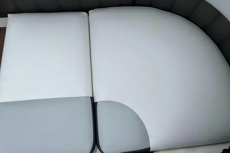 Slide: The Image of White and gray seating on a 2011 Regal 2500 Bowrider boat. - 14