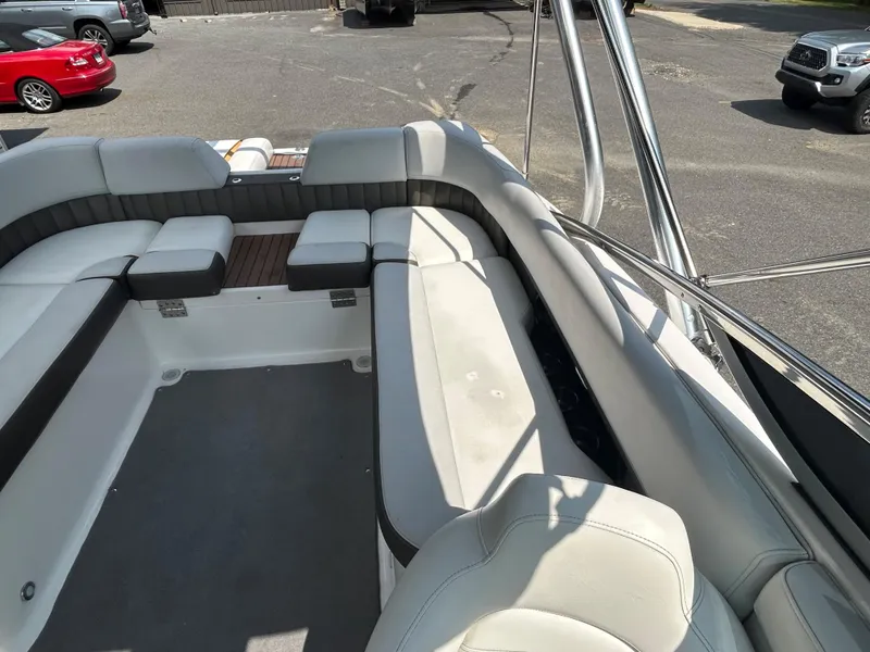 Slide: The Image of 2011 Regal 2500 Bowrider boat interior with spacious seating and modern design. - 17