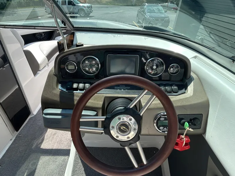 Slide: The Image of 2011 Regal 2500 Bowrider dashboard with steering wheel and instrument panel. - 21