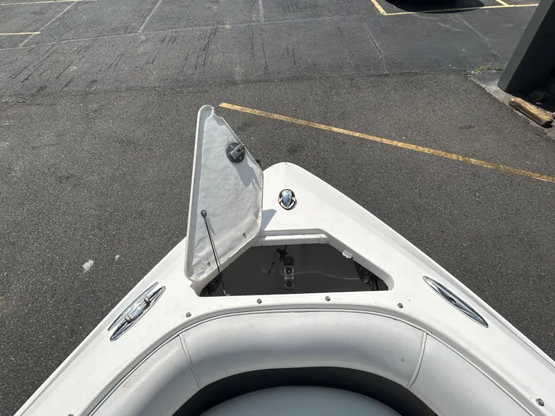 Slide: The Image of 2011 Regal 2500 Bowrider boat bow with open storage compartment. - 29