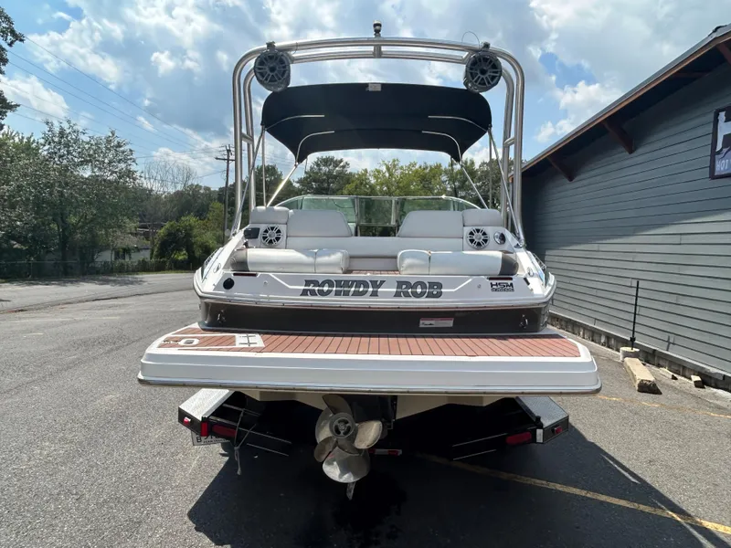 Slide: The Image of 2011 Regal 2500 Bowrider boat with custom name Rowdy Rob on the stern. - 5