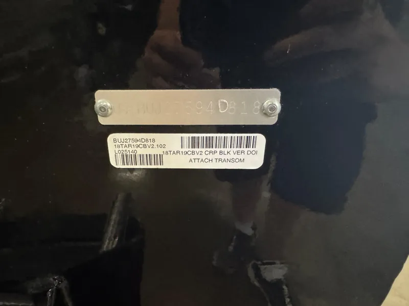 Slide: The Image of 2018 Tracker Targa V-19 WT boat interior with gray seating and storage compartments. - 5