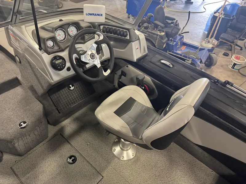 Slide: The Image of 2018 Tracker Targa V-19 WT boat interior with steering wheel and dashboard. - 7