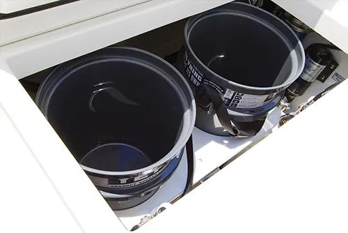 Slide: The Image of Two storage buckets in the 2024 Regulator 23 boat compartment. - 10