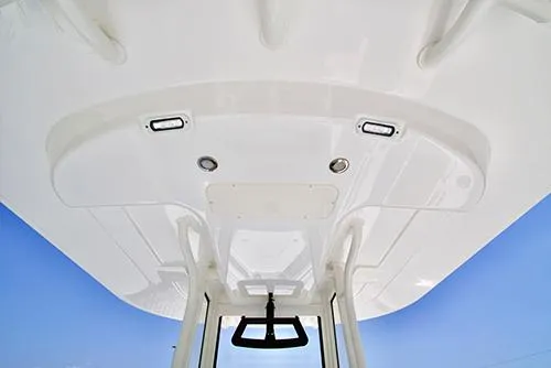 Slide: The Image of 2024 Regulator 23 boat T-top with integrated lights and rod holders. - 12